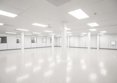 Spacious modular cleanroom with white walls, bright lighting, and a controlled environment.