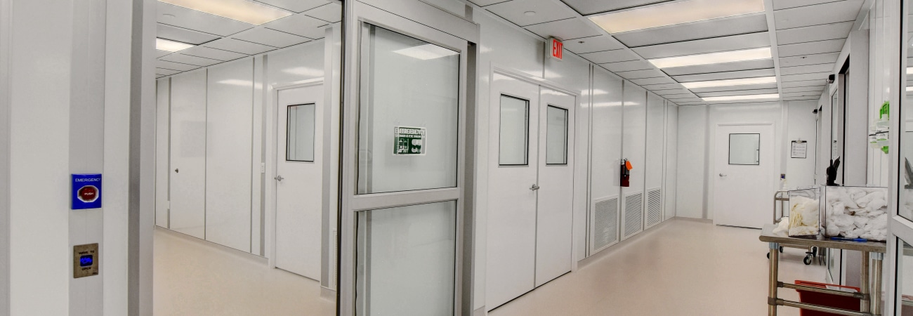 Interior view of a modular cleanroom built by Allied Cleanrooms, featuring sealed doors and pressure-controlled zones to meet cleanroom pressure differential requirements.