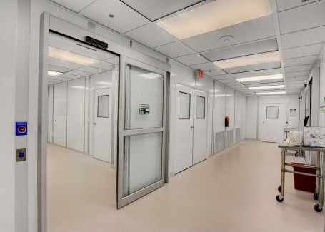 Interior view of a modular cleanroom built by Allied Cleanrooms, featuring sealed doors and pressure-controlled zones to meet cleanroom pressure differential requirements.