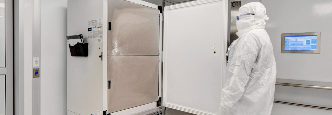 Aseptic cleanroom built by Allied Cleanrooms with gowned technician