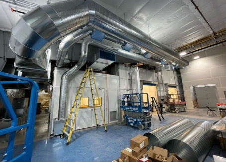 Assembling part of a cleanroom HVAC system.