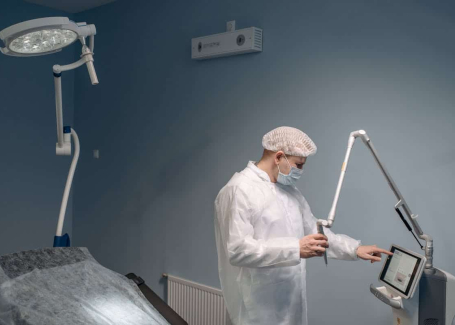 A doctor stands in an operating room.