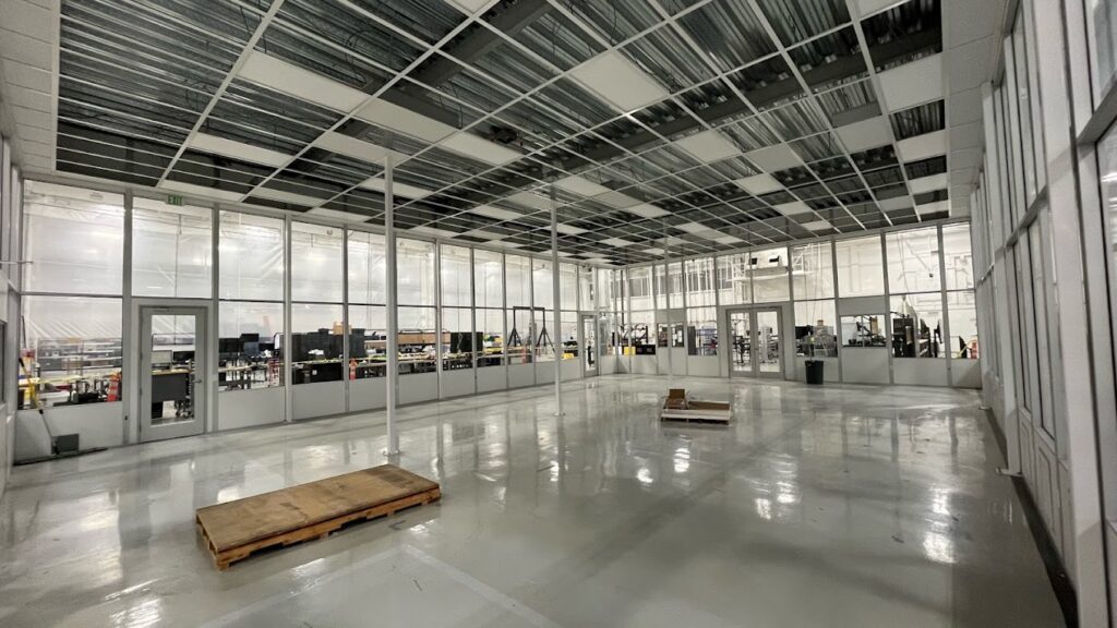 An image of a grid ceiling of a modular cleanroom under construction.