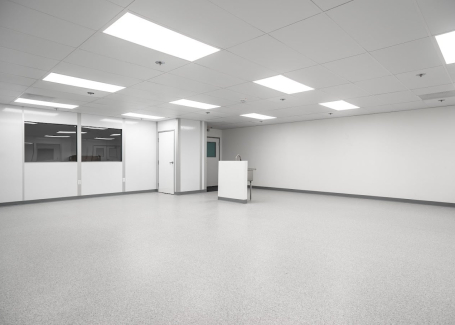 A clean, empty climate-controlled room with bright overhead lighting and smooth, sterile flooring.
