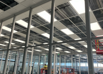 Cleanroom ceiling installation by Allied Cleanrooms with full glass wall panels
