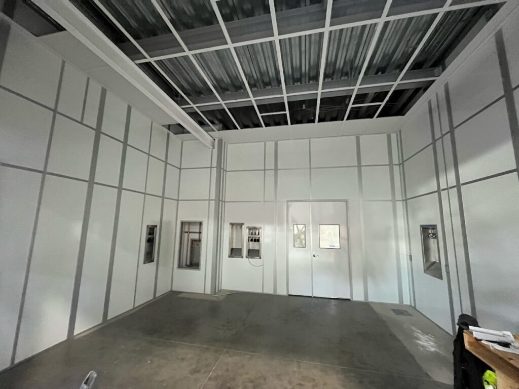 A partially constructed GMP cleanroom with walls and doors, highlighting the layout and infrastructure before final completion.