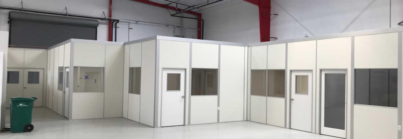Modular cleanroom installation by Allied Cleanrooms inside a warehouse facility