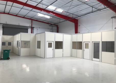 Modular cleanroom installation by Allied Cleanrooms inside a warehouse facility