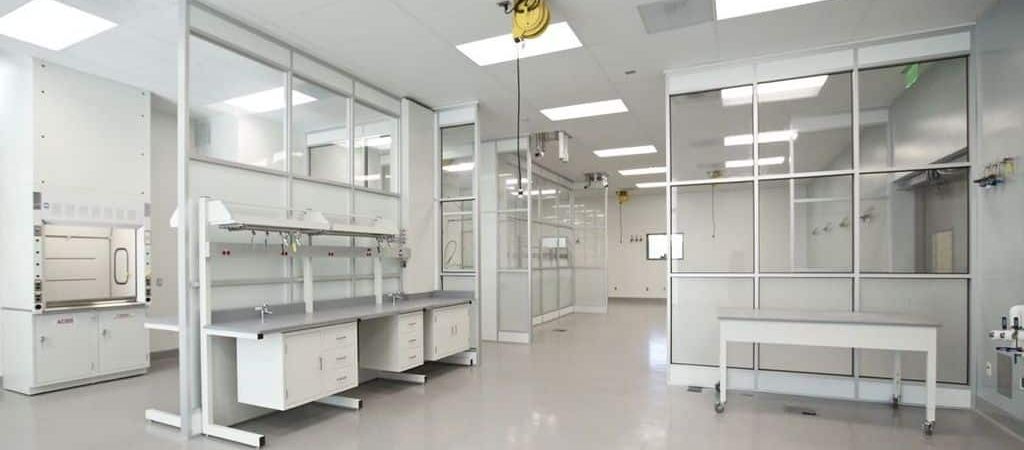 Modern pharmaceutical cleanroom featuring sterile workstations, overhead service carriers, and controlled environment modules for contaminant-free operations.