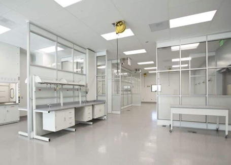 Modern pharmaceutical cleanroom featuring sterile workstations, overhead service carriers, and controlled environment modules for contaminant-free operations.