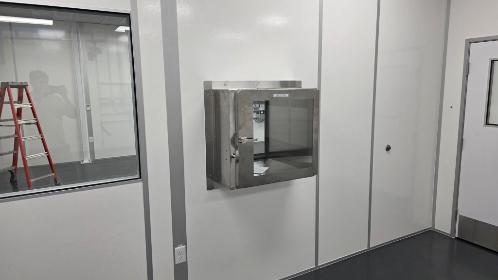Interior of buffer room with pass-through chamber by Allied Cleanrooms.