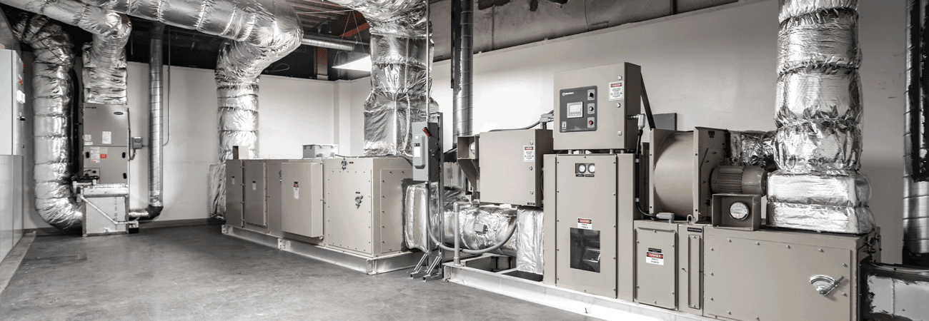Allied Cleanrooms air handling unit system with large insulated ductwork installed in a cleanroom mechanical space