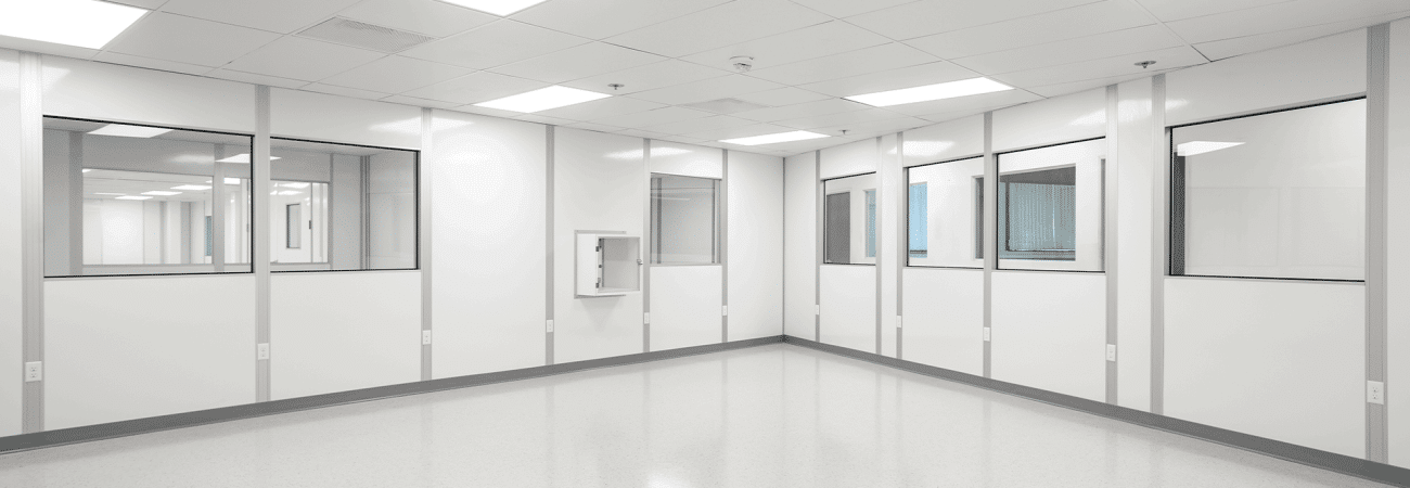 Allied Cleanrooms modular cleanroom interior with white wall panels, observation windows, LED lighting, and seamless flooring.