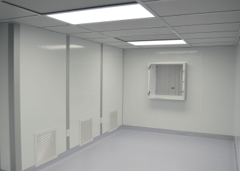 Interior of a 503B cGMP cleanroom built by Allied Cleanrooms, showing smooth wall panels, return air grilles, and a pass-through chamber.