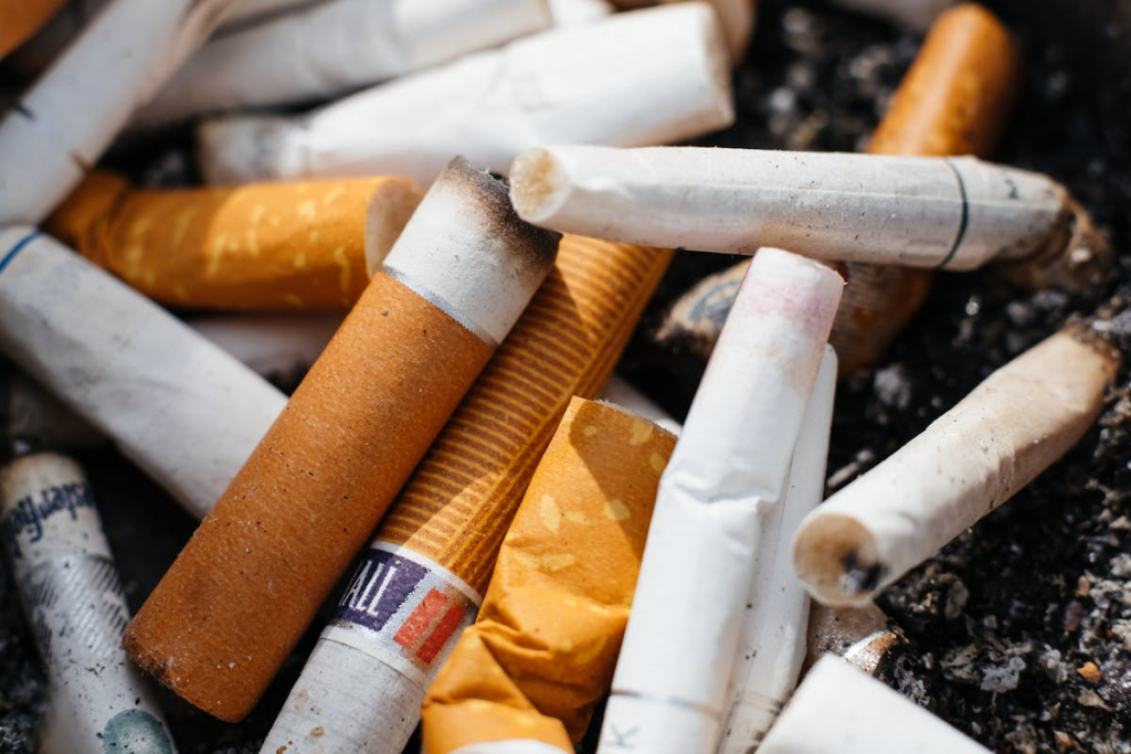 Cigarette butts in an ashtray — cigarettes are banned from cleanrooms