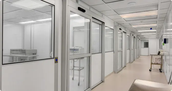 Modular cleanroom corridor with glass-walled rooms on both sides